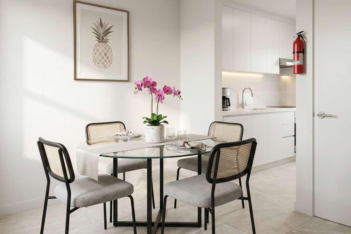Dining area with a glass table beside the kitchen at Falls of Westpark apartment in Houston, TX